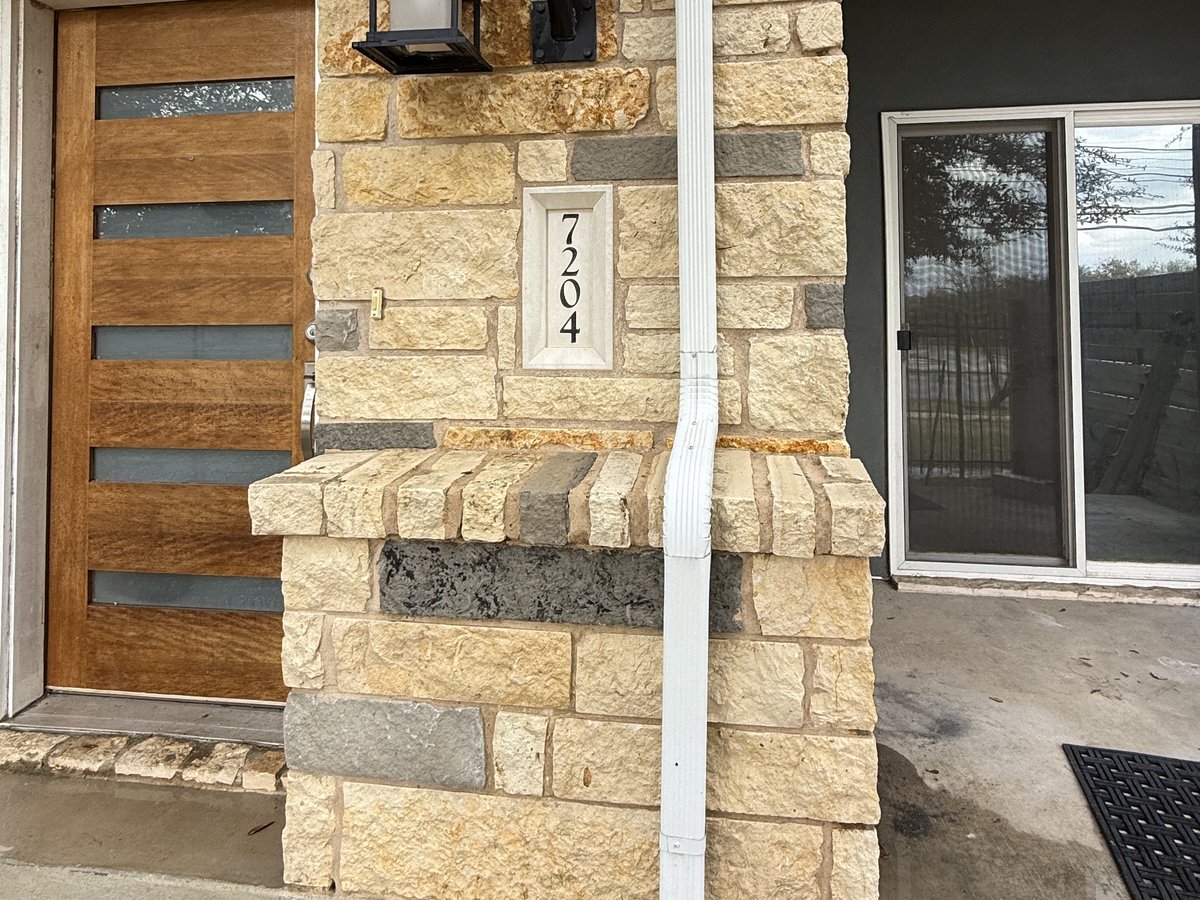 After soft washing — clean stone exterior by River Blue Services