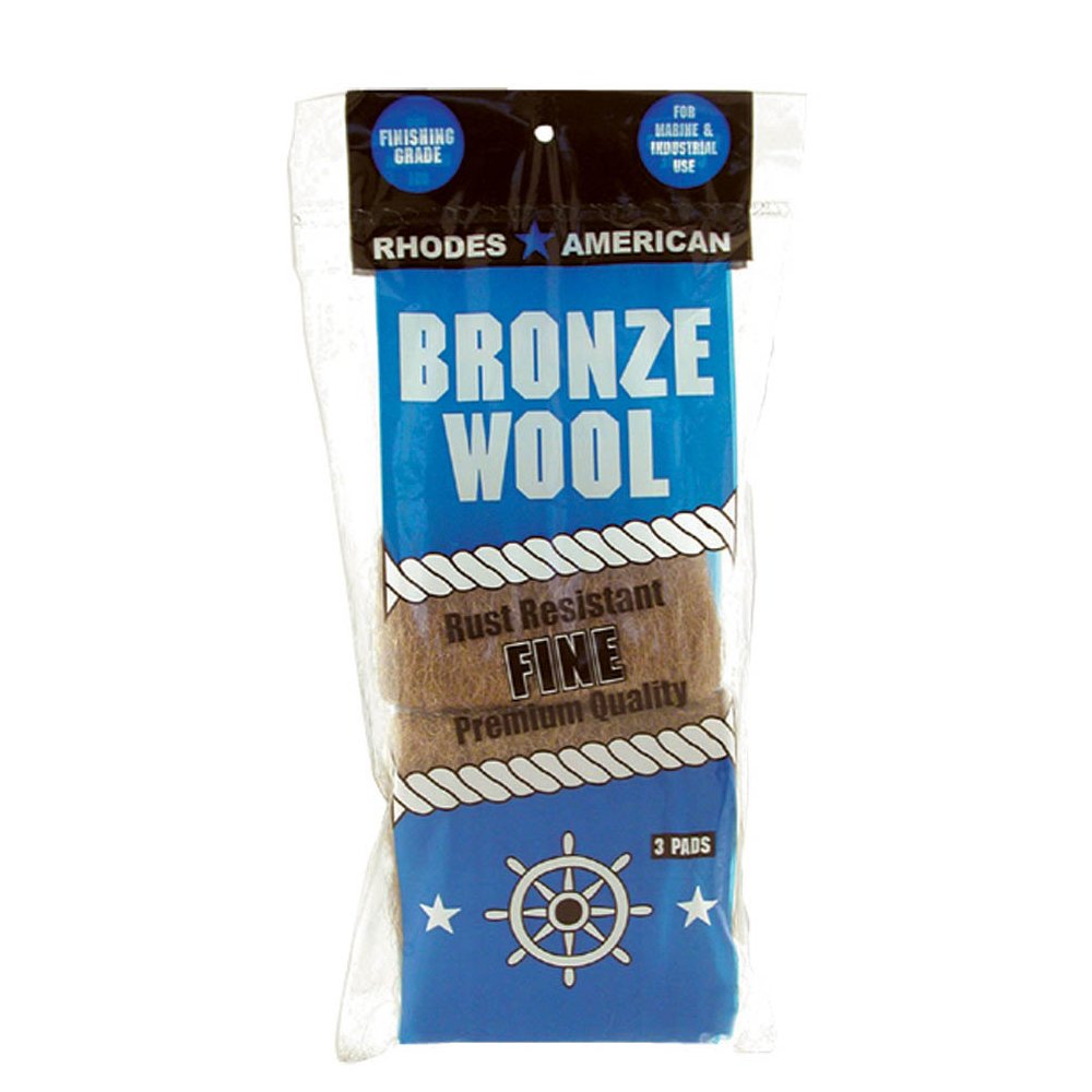 Fine bronze wool pads for removing hard water buildup from glass