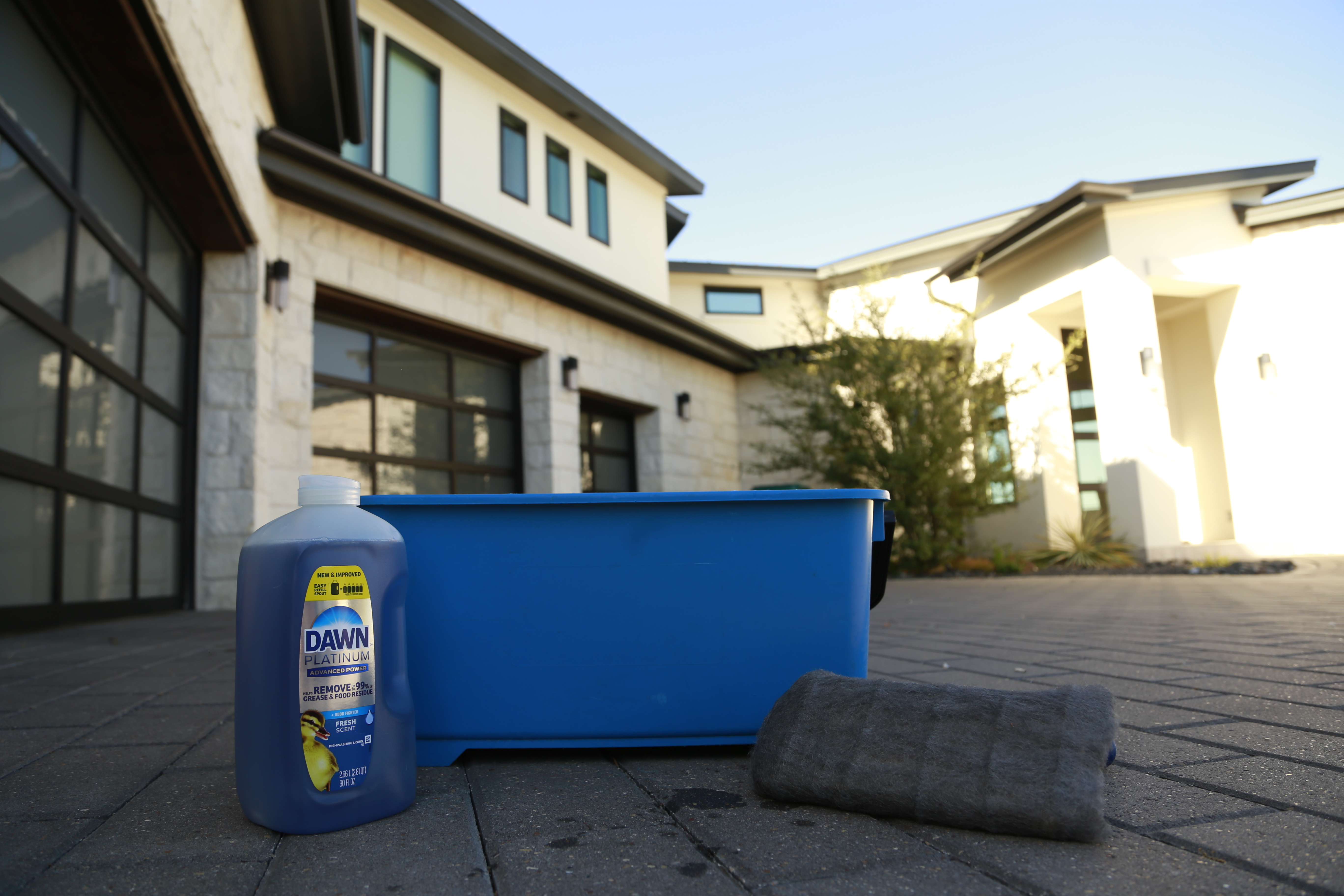 Window cleaning basic tools - bucket, soap, and towel